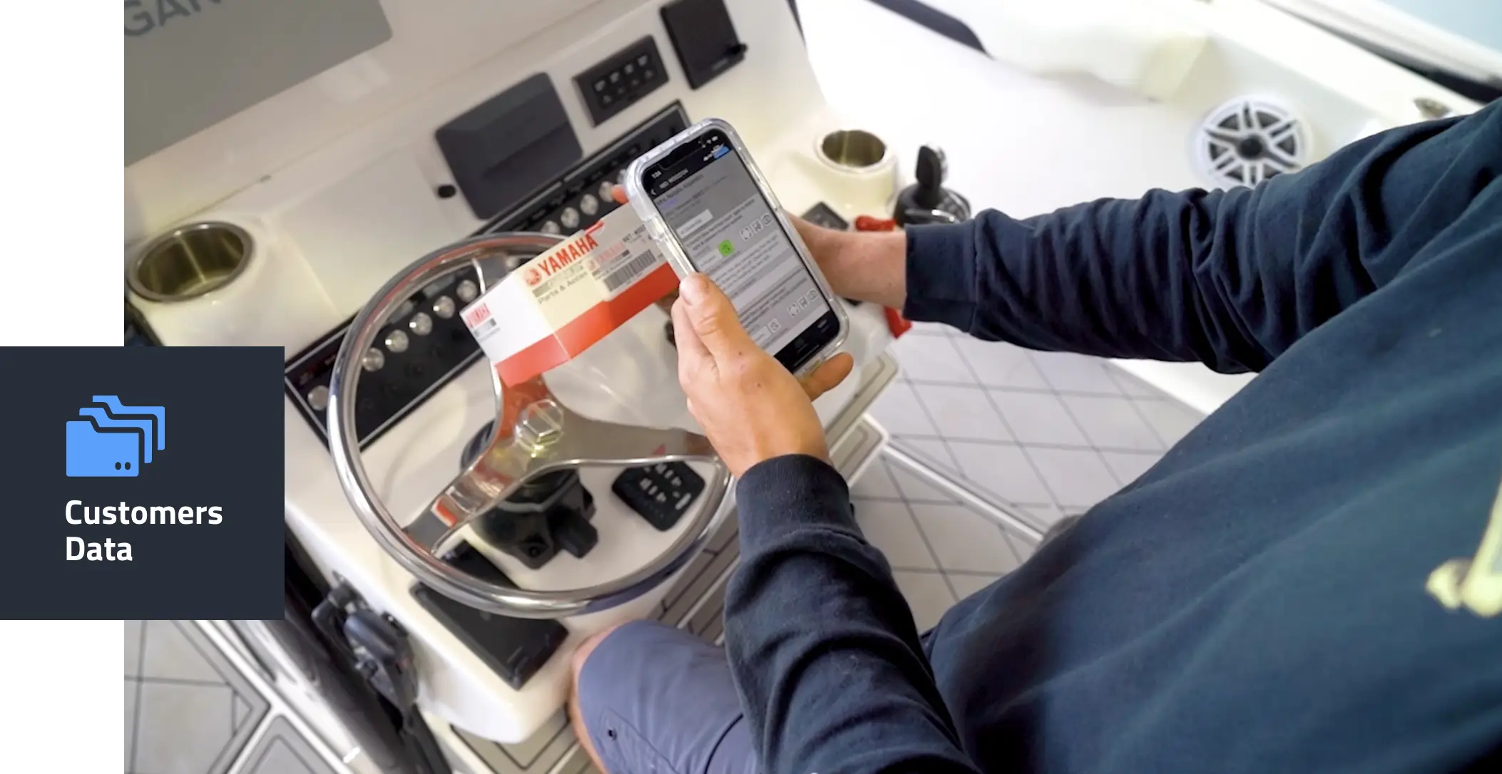 Winboats user accessing customer data on a mobile device for targeted boat dealership marketing campaigns.