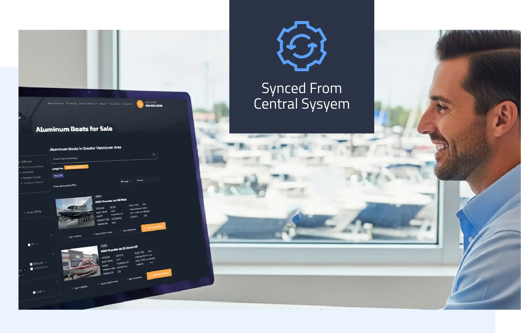Smiling man viewing a computer screen displaying an aluminum boats for sale webpage with live inventory, alongside a “synced from central system” icon, representing winboats’ time-saving automated website integration for dealerships.